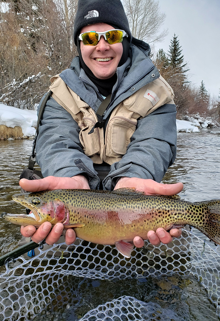Our friend Denver with a great Blue River Rainbow Trout for our winter fly fishing class.
