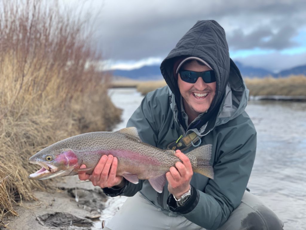 Colorado Trout Hunters Guide Cooper Hopkins with a trophy rainbow trout from the Platte.