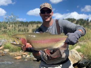 MLB pitcher Adam Wainwright with a trophy rainbow trout.