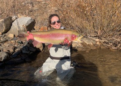 Chrissy with a perfect rainbow trout from a guided fly fishing trip to the North Fork of the South Platte.