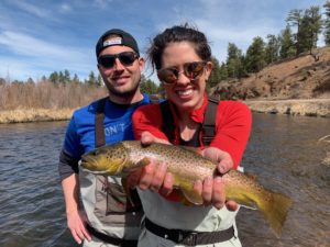 Happy couple on a spring guided fly fishing trip near Denver!
