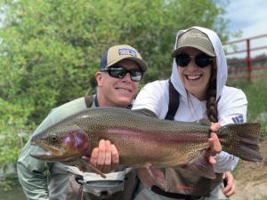 Father and Daughter fly fishing near Denver.