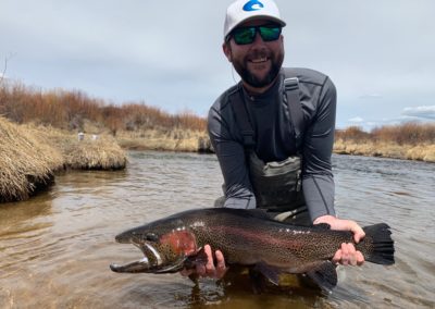 Fly fishing for giant trout at Rolling J Ranch.