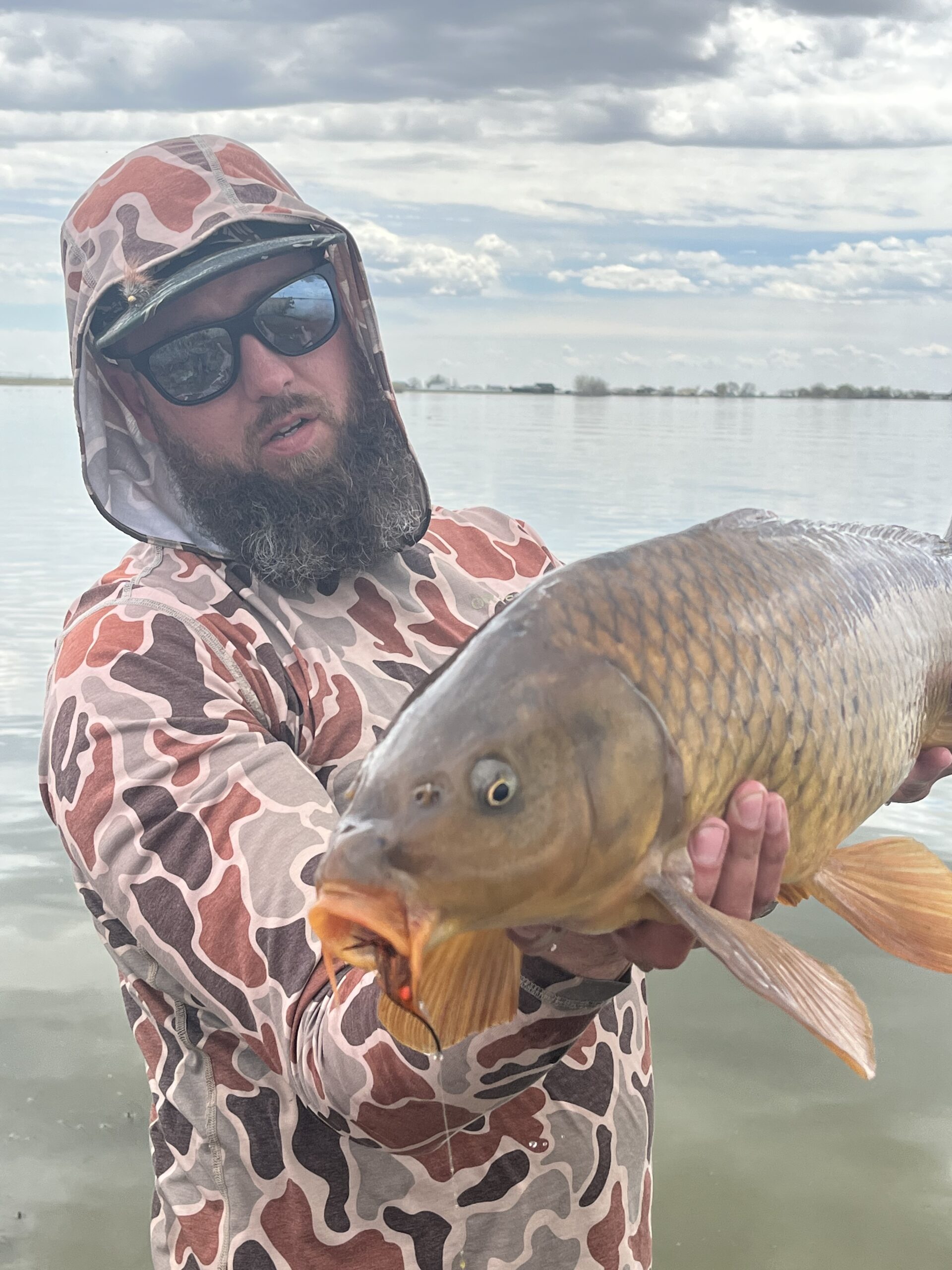 Warmwater fly fishing guide Rick Mikesell with a big carp on the fly.