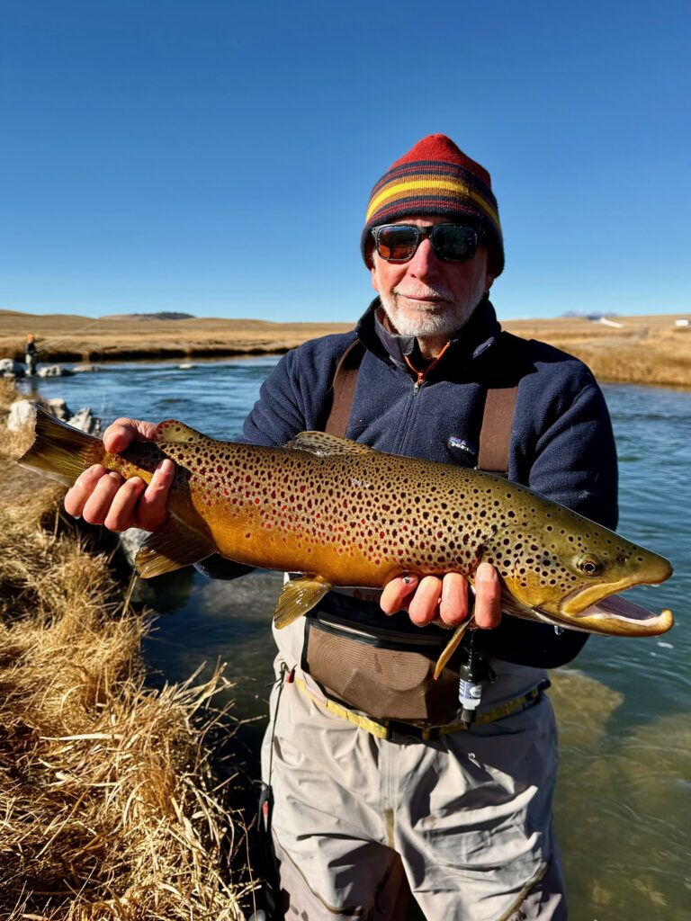 Mark with a great lake run brown with guide Matt Sandersen